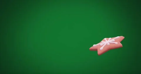 Animation of christmas star gingerbread cookie with copy space on green Stock Footage 329283660