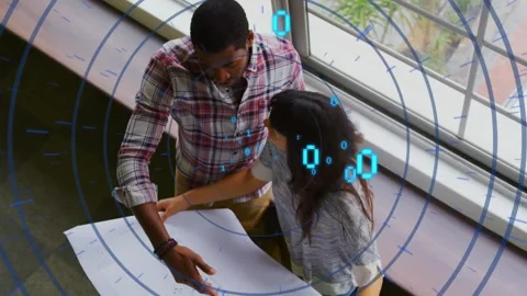 Animation of circles and binary codes over diverse coworkers analyzing blueprint Stock Footage 245331371