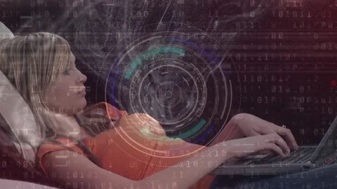 Animation of circles, binary code over caucasian young woman using laptop while 動画素材 328456368