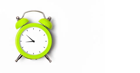 Animation of clock hands of lime green metal alarm clock isolated on white Stock Footage 235398090