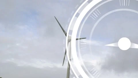 Animation of clock over wind turbine at sunset 스톡 동영상 327582777