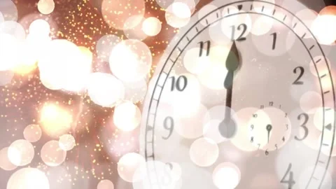 Animation of clock showing midnight and fireworks exploding with spots of light 库存影片 257074913