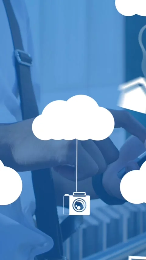 Animation of clouds with electronic devices over caucasian man using smartphone Stock Footage 344693724