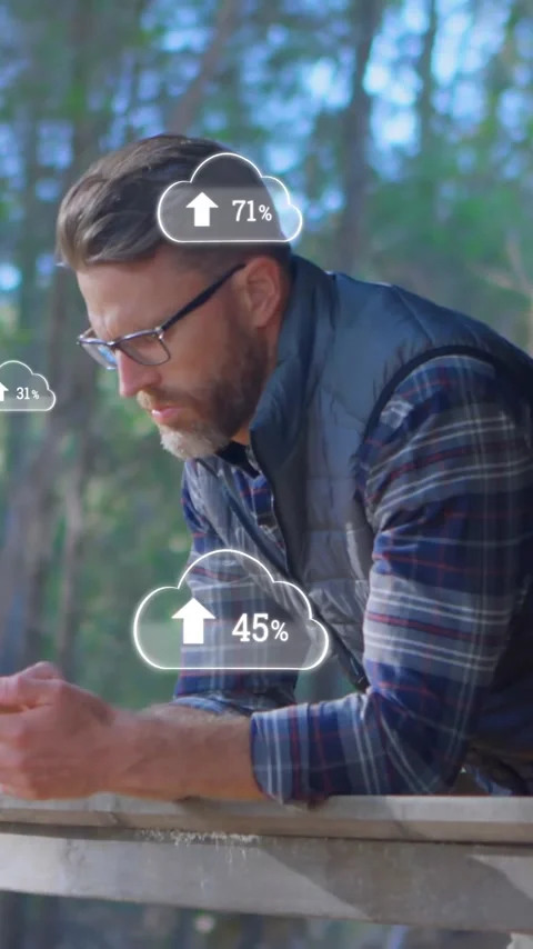 Animation of clouds with growing numbers over caucasian man using smartphone Stock Footage 342812765