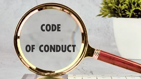 Animation of the CODE OF CONDUCT concept words through a magnifying glass on a Stock-Footage 315815570