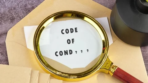 Animation of the CODE OF CONDUCT concept words through a magnifying glass on a Stock-Footage 316945486