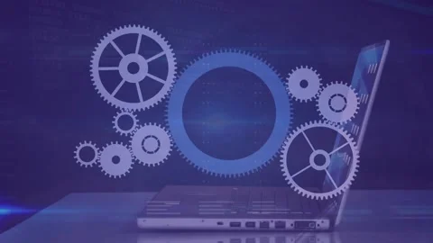 Animation of cogs moving over businessman using laptop Stock Footage 239431963