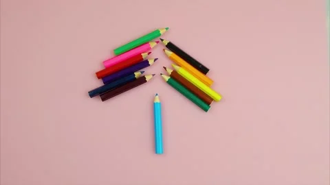 Animation of colored pencils, they move and make sun. pink background. Видео 136848640