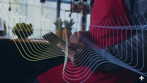 Animation of colorful wave patterns overlaying person sitting in modern cafe Stock Footage 304160297