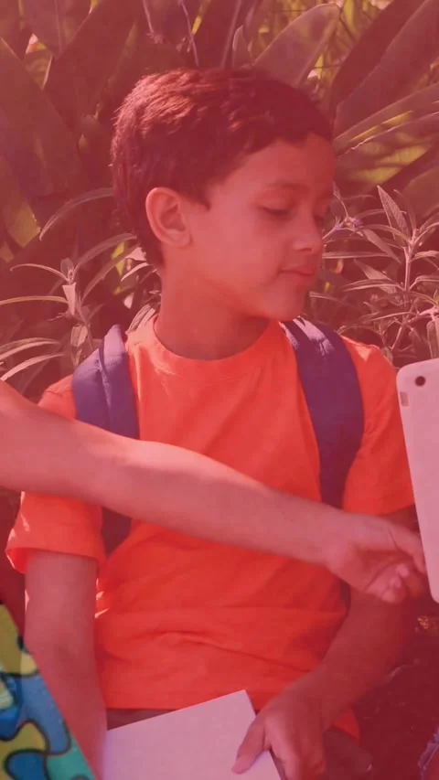 Animation of colourful puzzle pieces over kids friends using electronic devices Stock Footage 344524791