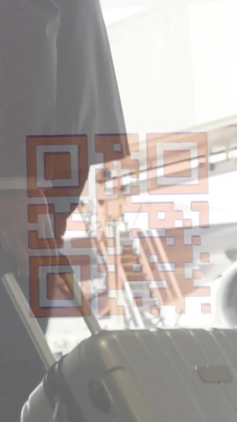 Animation of a colourful QR code in loop over man carrying his suitcase Stock Footage 323898803