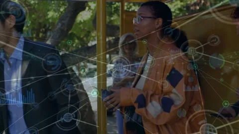 Animation of computer icons connecting with lines over diverse commuters using Stock Footage 204820305