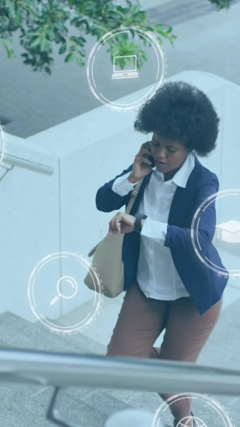 Animation of computer icons over african asian woman talking on cellphone and Stock Footage 321171980