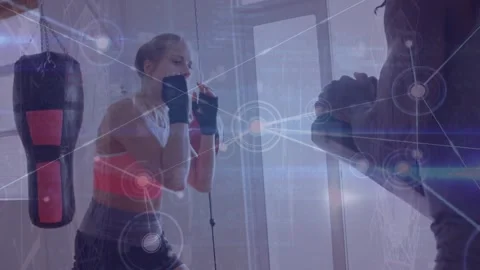 Animation of computer language, connected dots, female boxer practicing kicks Stock Footage 327196031