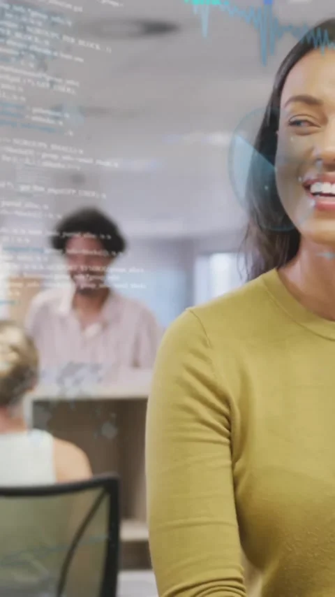 Animation of computer language over diverse female coworkers standing and Stock Footage 323579063