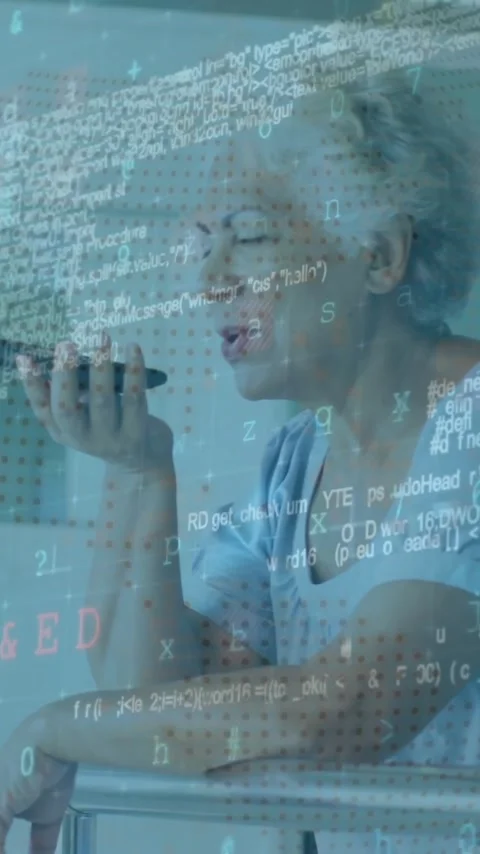 Animation of computer language over senior woman talking on speaker of cellphone Stock Footage 323578888
