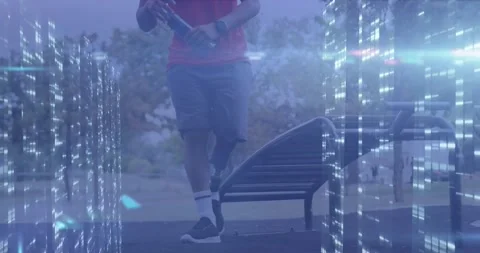 Animation of computer servers processing data over male athlete with prosthetic Stock Footage 328159648