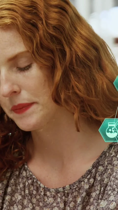 Animation of connected icons forming globes over caucasian woman talking on Stock Footage 323578583