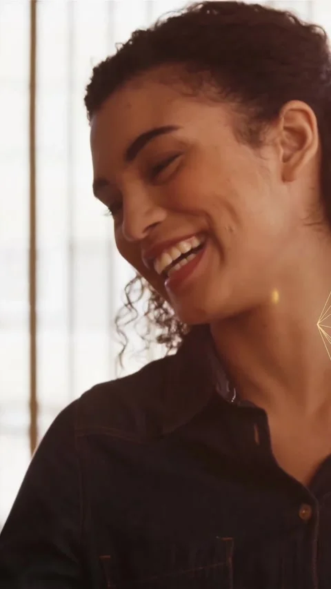 Animation of connected icons globe over smiling woman with coffee cup talking on Stock Footage 323578588