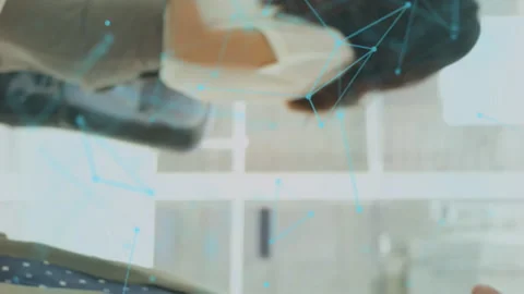 Animation of connections and bionic security over diverse businesspeople shaking 스톡 동영상 312420869