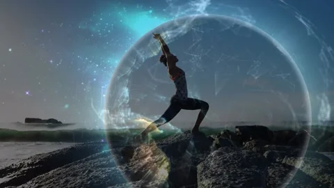 Animation of connections and globe over woman practicing yoga on beach at sunset Stock Footage 330336359