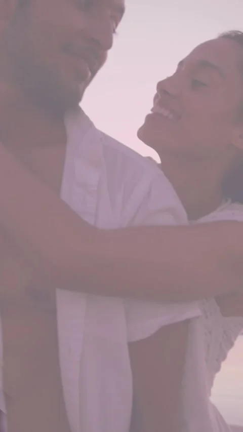 Animation of couple embracing over spots of light Vídeo Stock 342996286