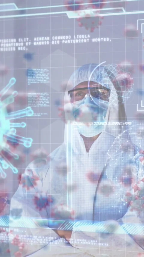 Animation of covid 19 cell and data on screen over caucasian woman un ppe suit Stock Footage 343615322