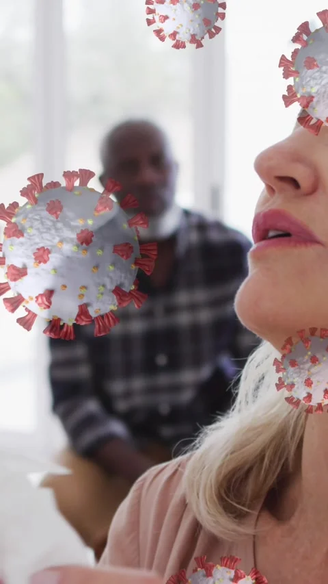 Animation of covid 19 cells over caucasian woman sneezing Stock Footage 331719818