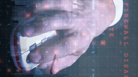 Animation of cyber attack warning and hand holding mouse over cityscape Video stock 315218066