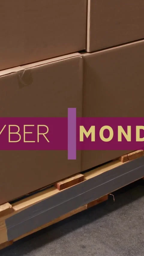 Animation of cyber monday text over boxes in warehouse Stock Footage 341659823