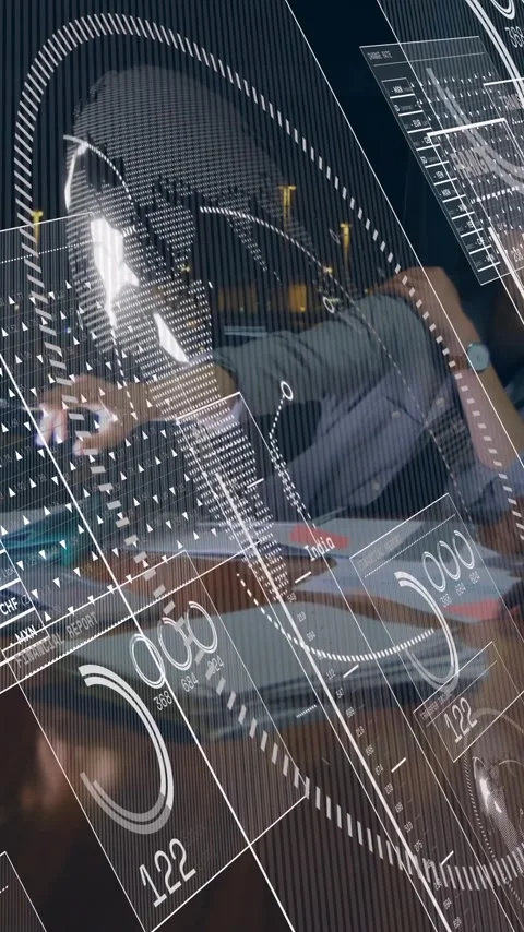 Animation of data analytics overlaying people working at office desk in school Stock Footage 344244787