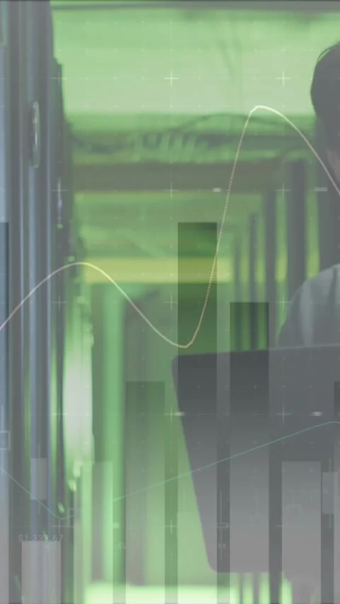 Animation of data processing against asian male engineer using laptop working at Stock Footage 344636905