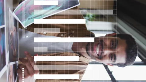 Animation of data processing against man showing documents talking on video call Stock Footage 313331828