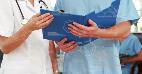 Animation of data processing and chemical formula over diverse doctors reading Stock Footage 309355247