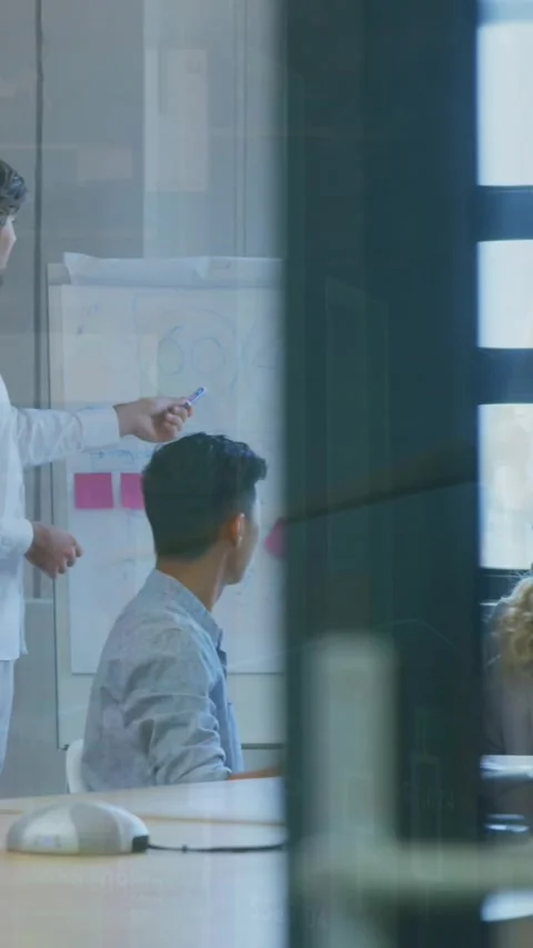 Animation of data processing and cityscape over diverse business people at Stock Footage 344635799