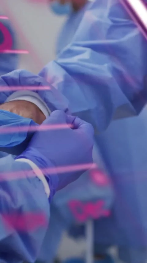 Animation of data processing and diagrams over diverse surgeons in operating Stock Footage 342954086