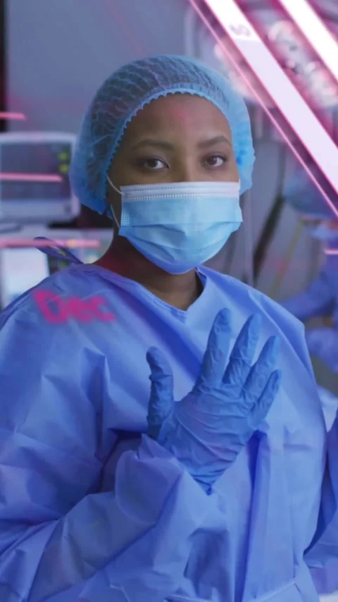 Animation of data processing and diagrams over diverse surgeons in operating Stock Footage 343028351