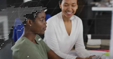 Animation of data processing and world map over diverse female colleagues Stock Footage 328457792