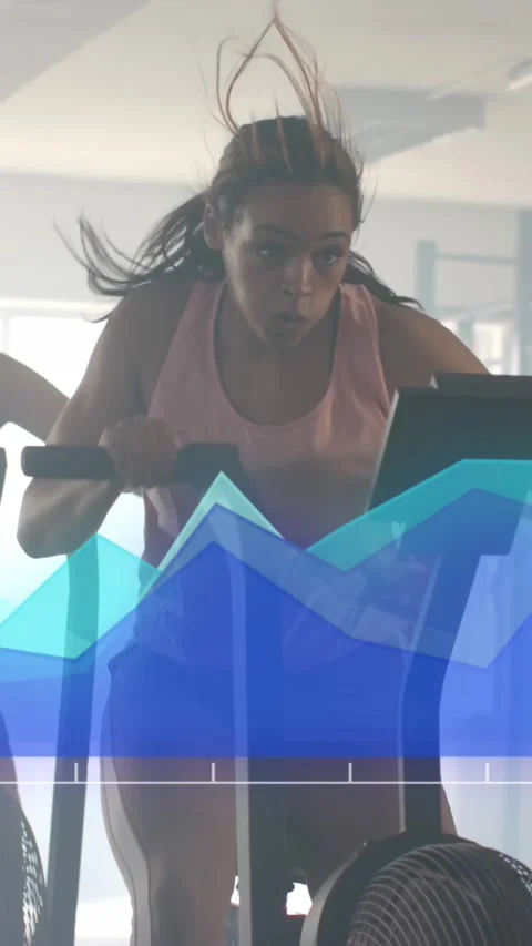 Animation of data processing on blue graph over diverse women cross training on Stock Footage 323783011