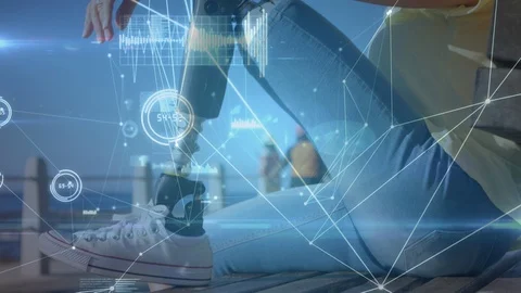 Animation of data processing with female with prosthetic leg in background 스톡 동영상 125859930