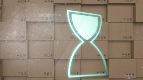 Animation of data processing with hourglass spinning over stack of cardboard Stock Footage 159967344