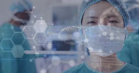 Animation of data processing with molecules and brains over asian female surgeon Stock Footage 309077758