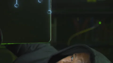 Animation of data processing over african american male hacker with computer and Stock Footage 312608880