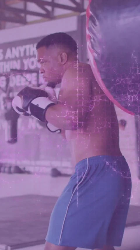 Animation of data processing over african american man exercising in boxing gym Stock Footage 323897575
