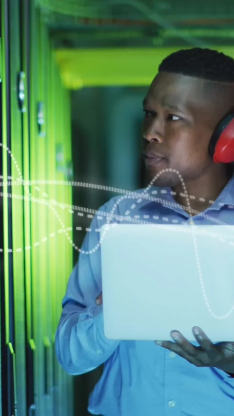 Animation of data processing over african american male it engineer and computer Stock Footage 323899860