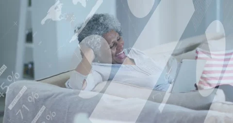 Animation of data processing over african american woman having a video call on Video stock 330771548