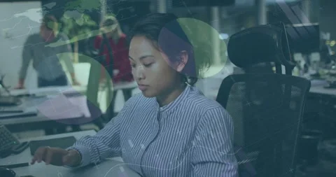 Animation of data processing over asian businesswoman using computer Stock Footage 328592991