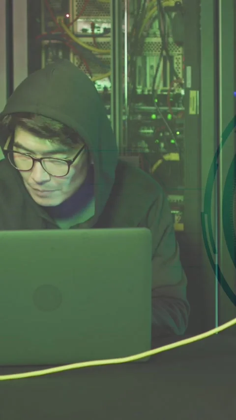 Animation of data processing over asian male hacker in server room Stock Footage 342704323