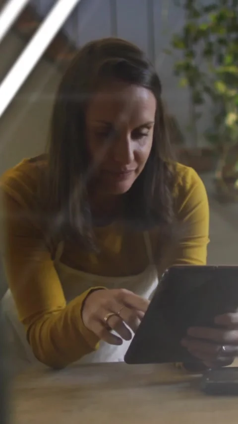 Animation of data processing over businesswoman using tablet in office Stock Footage 341927658