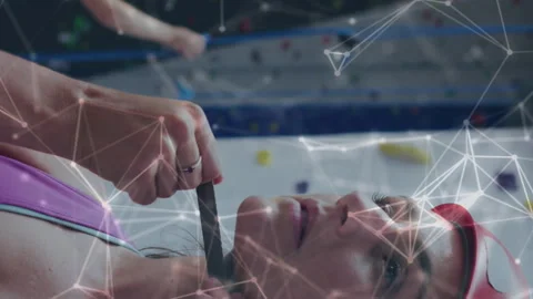 Animation of data processing over caucasian women climbing wall Stock Footage 312421335